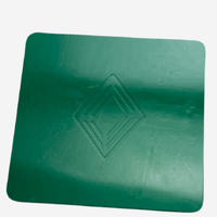 Green leather mahjong mat with embossed Club Mah Jongg icon laid flat