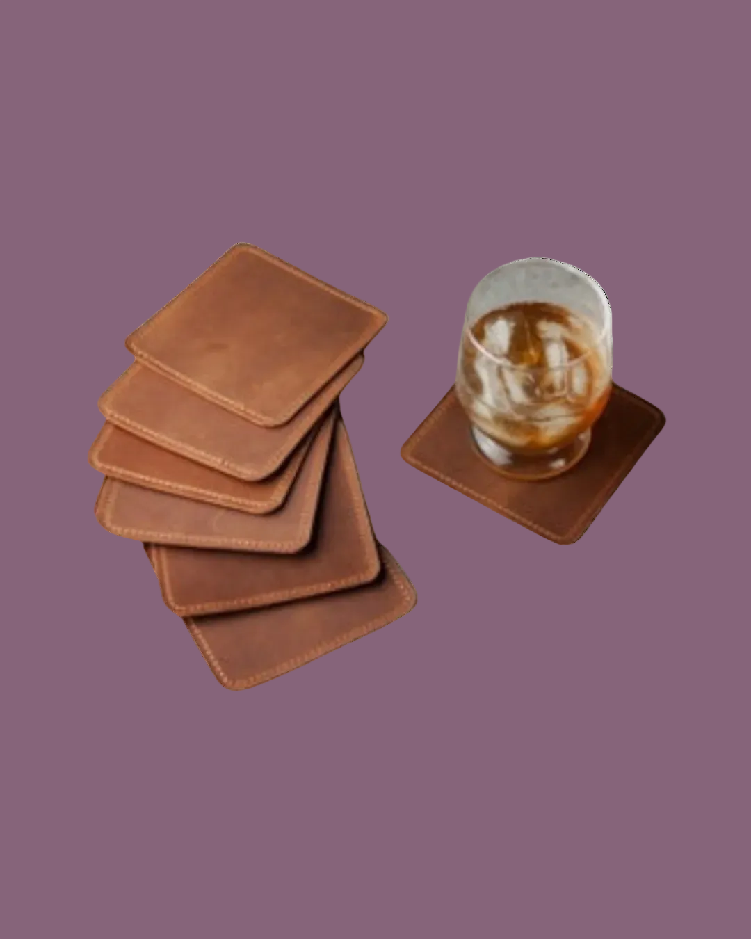 Six brown leather coasters, from Club Mah Jongg on the left shown next to a glass with ice and cola or whiskey sitting on a 7th leather coaster on a transparent background 