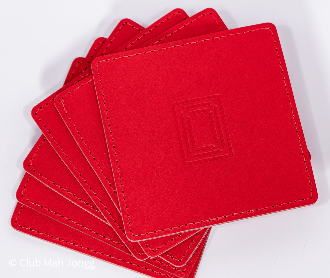 Fanned stack of red square leather mahjong coasters